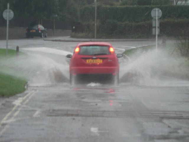 Car driving on flooded road